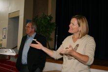 Local 111 member Diane Newton-Prior encourages classified employees at Sitton Elementary to stand during a presentation of a $5,000 AFL-CIO  Adopt-A-School grant.